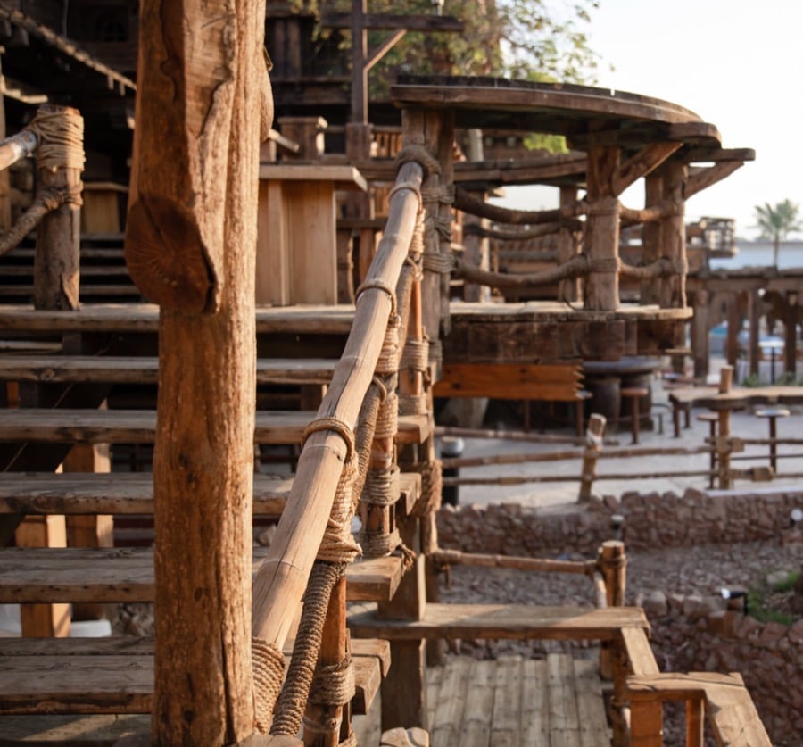 Rustic wooden structure and stairway supported by a community project