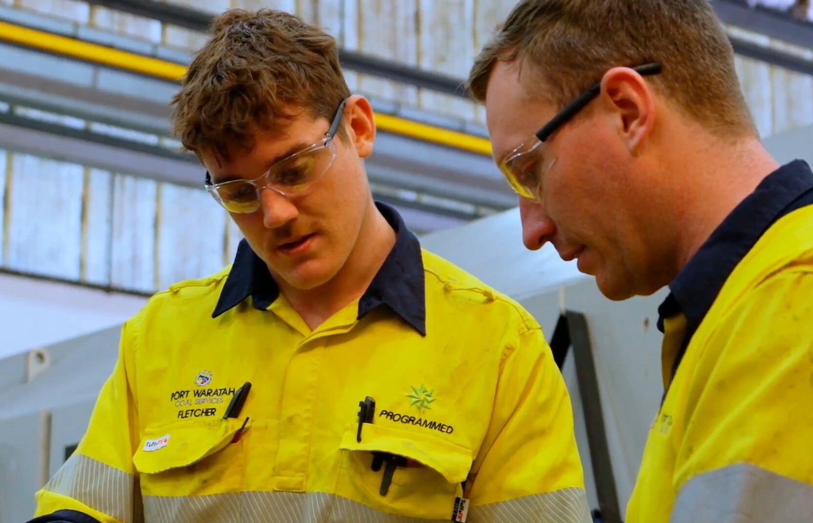 Port Waratah apprentice Fletcher being mentored by a Programmed tradesperson