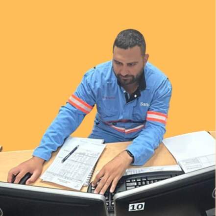 Programmed trainee working at a computer workstation